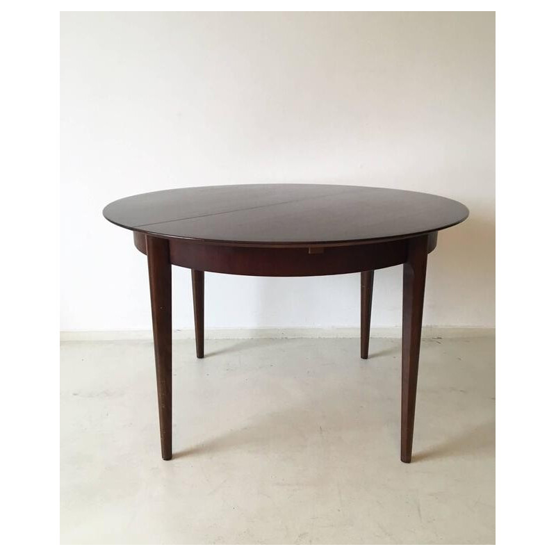Circular extendable dining table by Lubke - 1960s