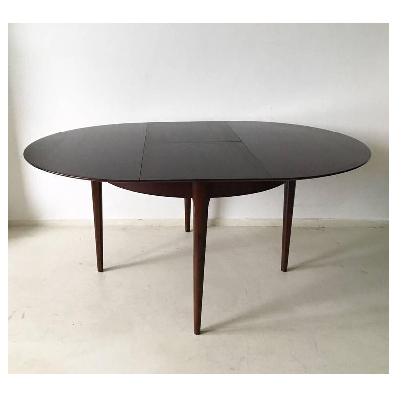 Circular extendable dining table by Lubke - 1960s