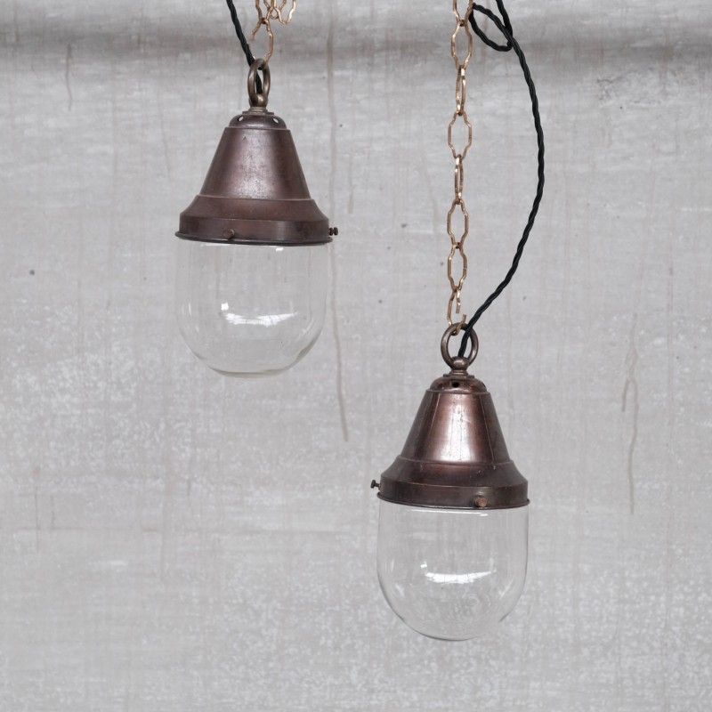 Pair of vintage brass and clear glass industrial pendant lamps, 1930s