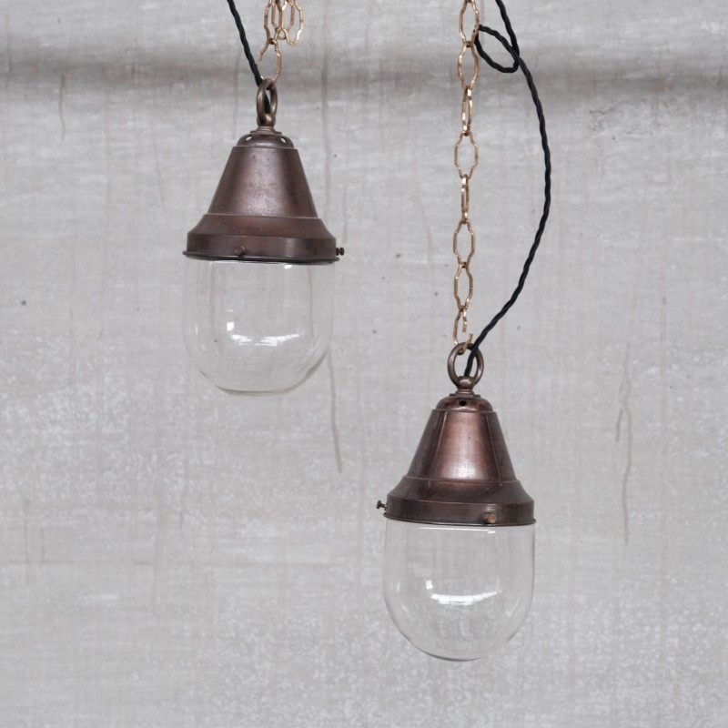 Pair of vintage brass and clear glass industrial pendant lamps, 1930s