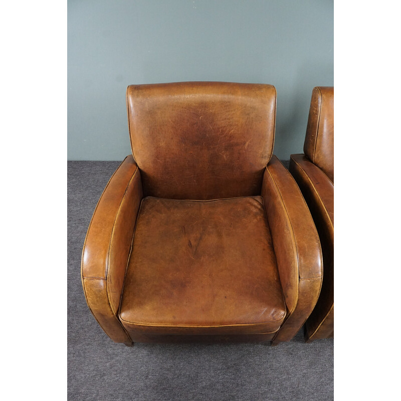 Paire de fauteuils vintage en cuir de mouton