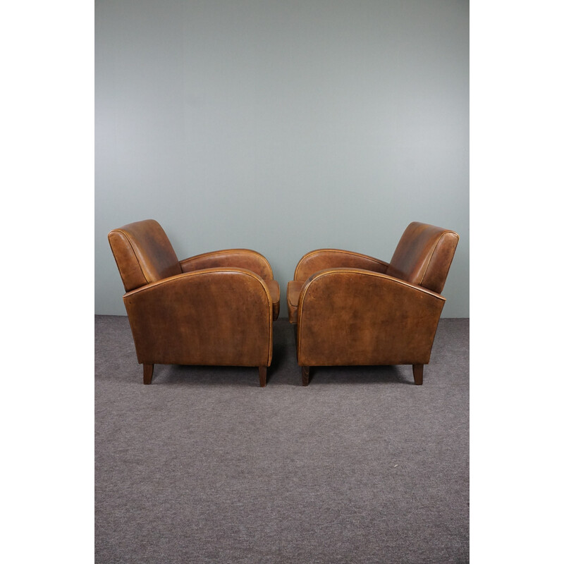 Paar vintage schapenleren fauteuils