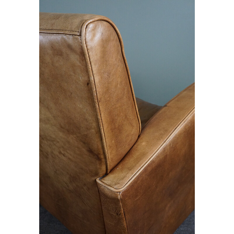 Pair of vintage cowhide leather armchairs