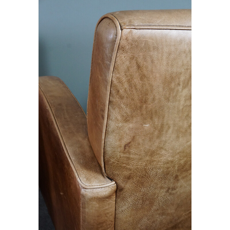 Pair of vintage cowhide leather armchairs