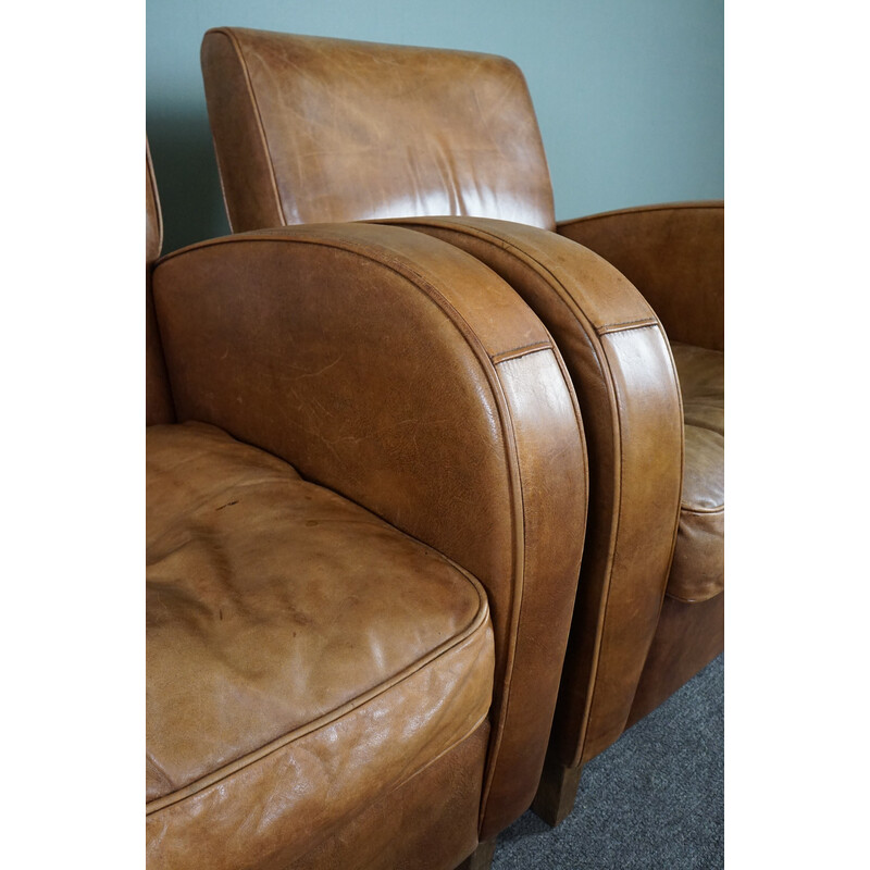 Pair of vintage cowhide leather armchairs