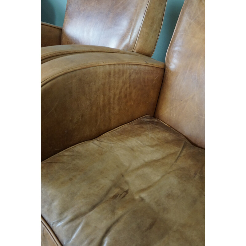 Pair of vintage cowhide leather armchairs