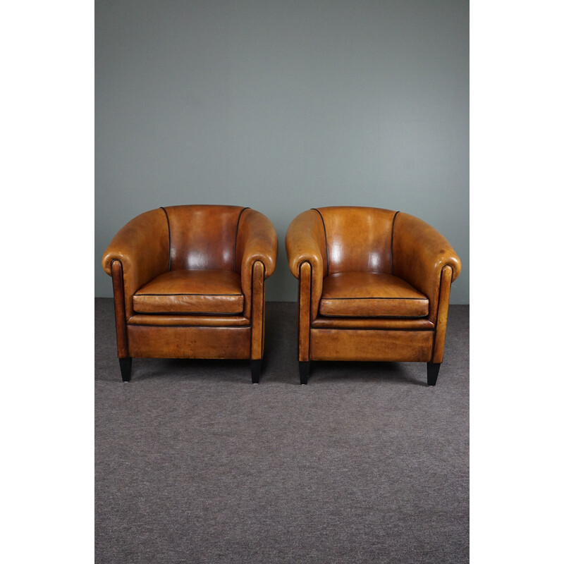 Pair of vintage sheep leather club armchairs with black piping