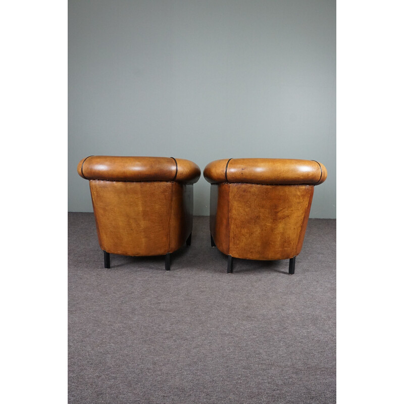 Pair of vintage sheep leather club armchairs with black piping