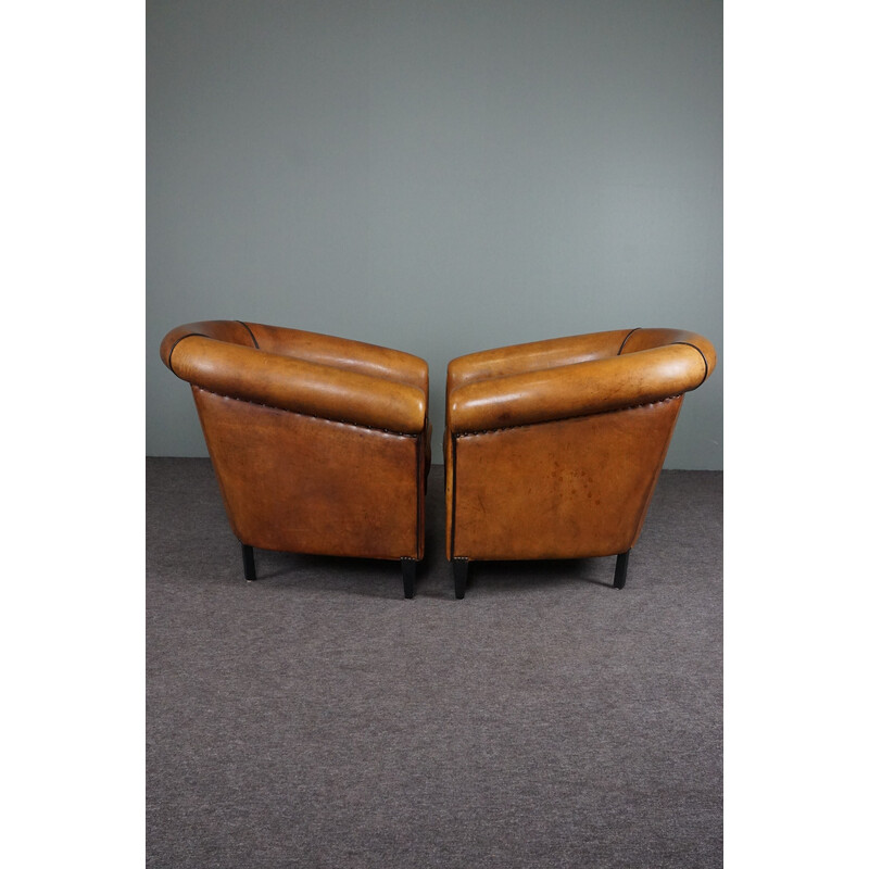 Pair of vintage sheep leather club armchairs with black piping