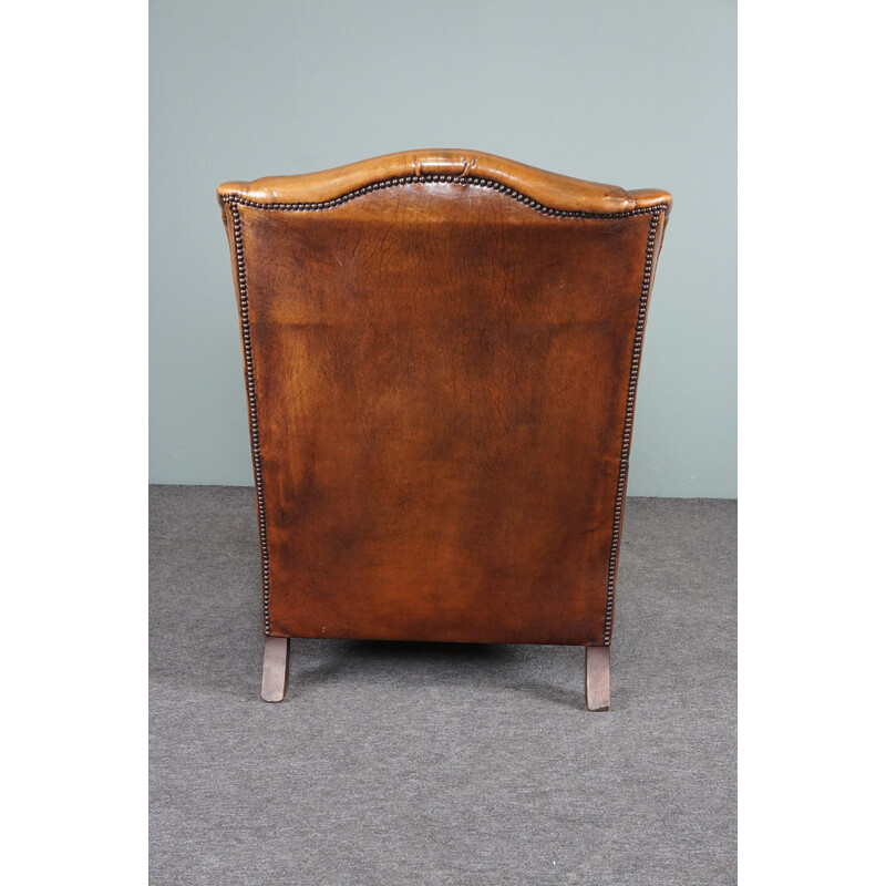 Vintage patinated sheep leather wing armchair