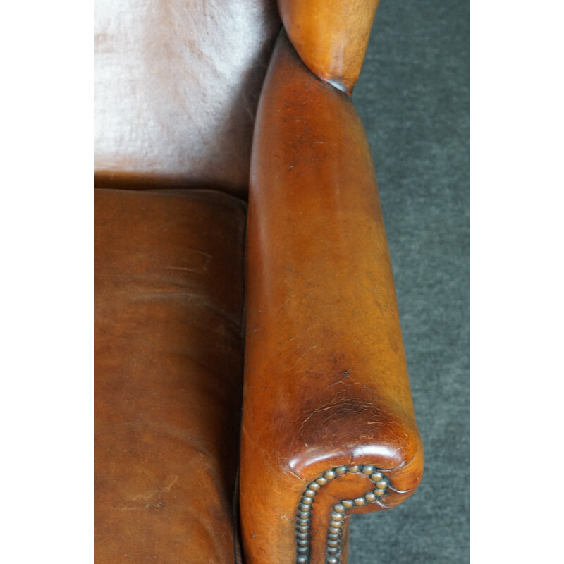 Vintage patinated sheep leather wing armchair
