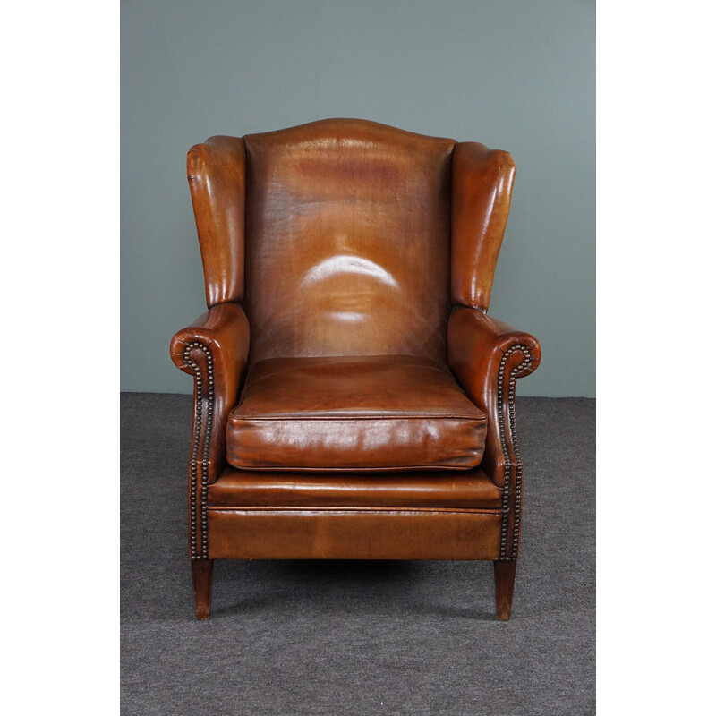 Vintage patinated sheep leather wing armchair