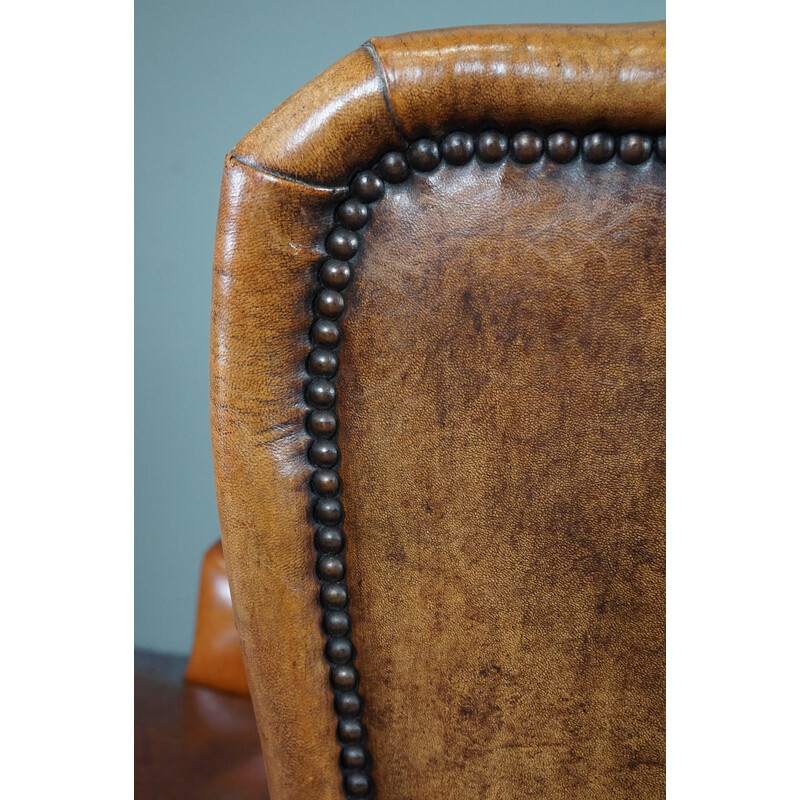 Vintage patinated sheep leather wing armchair