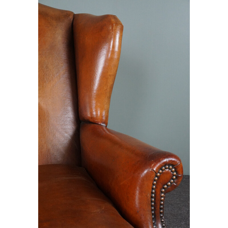 Vintage patinated sheep leather wing armchair