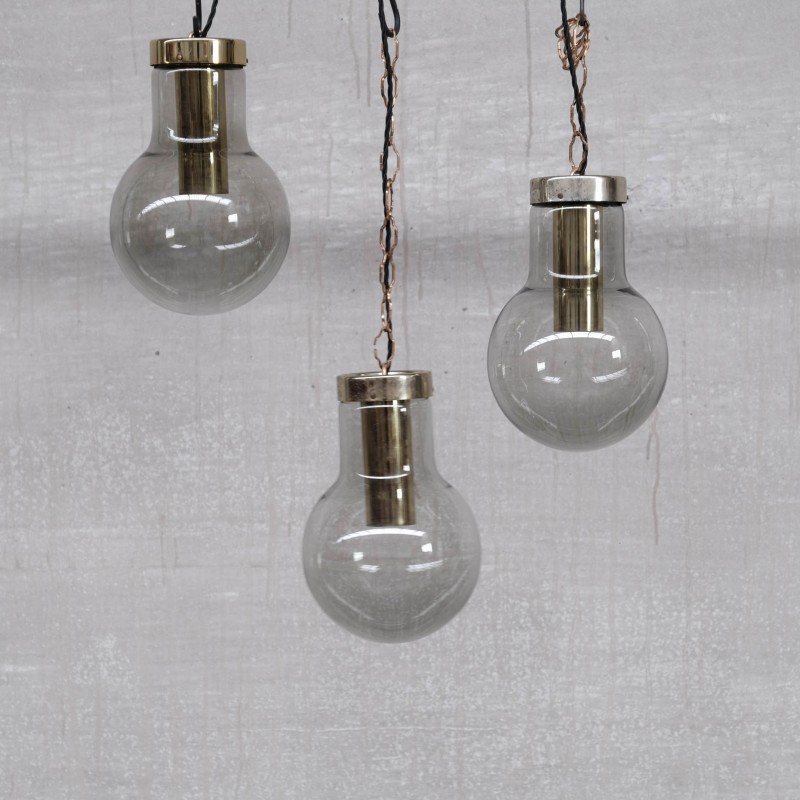 Mid-century smoked glass and brass pendant laps by Raak, Holland 1980s