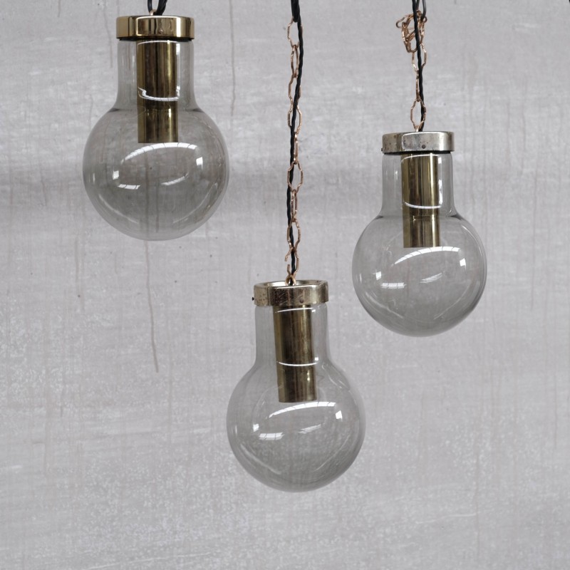 Mid-century smoked glass and brass pendant laps by Raak, Holland 1980s