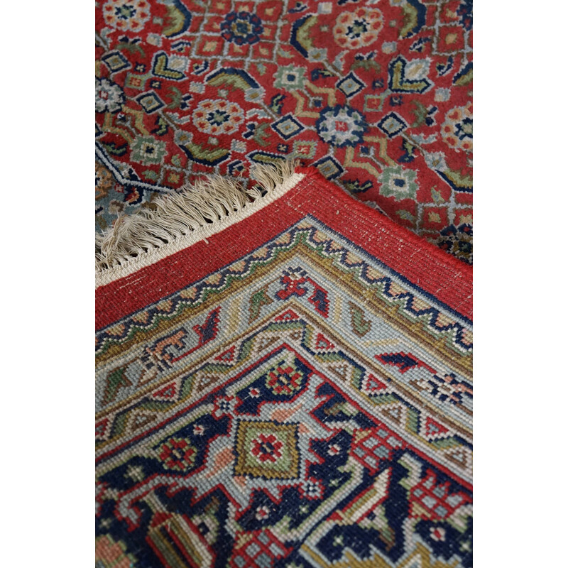 Vintage worn hand-knotted Oriental rug