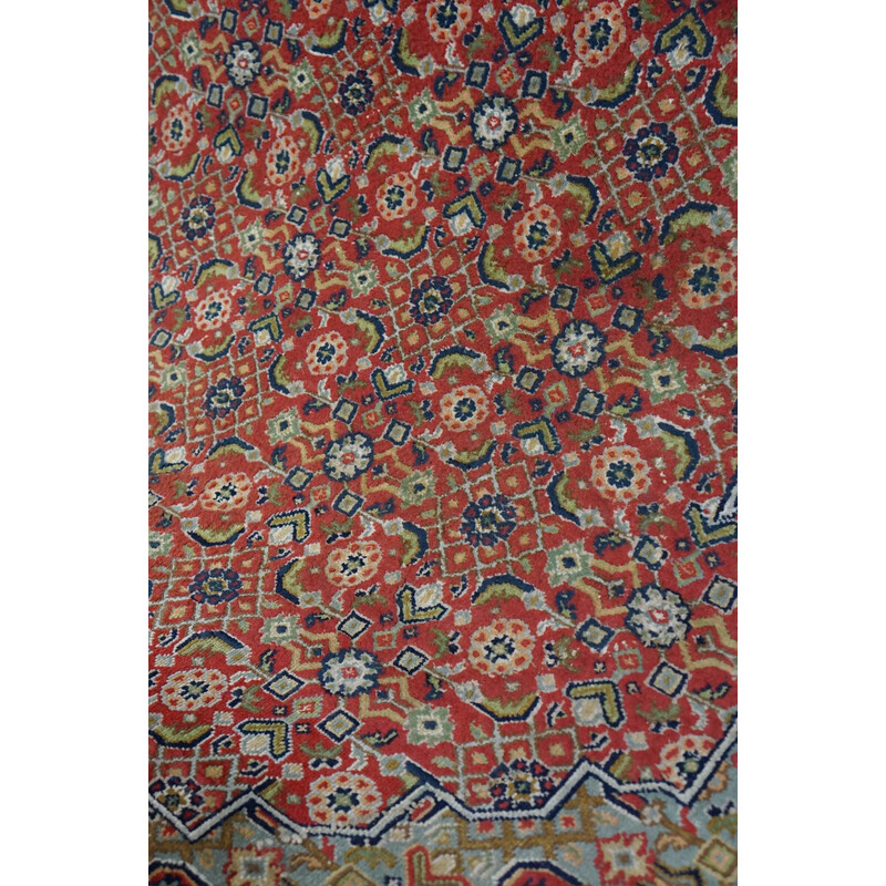 Vintage worn hand-knotted Oriental rug