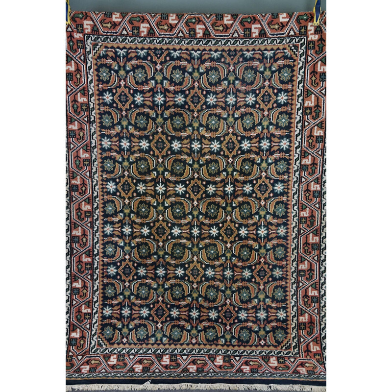 Vintage worn hand-knotted Oriental rug