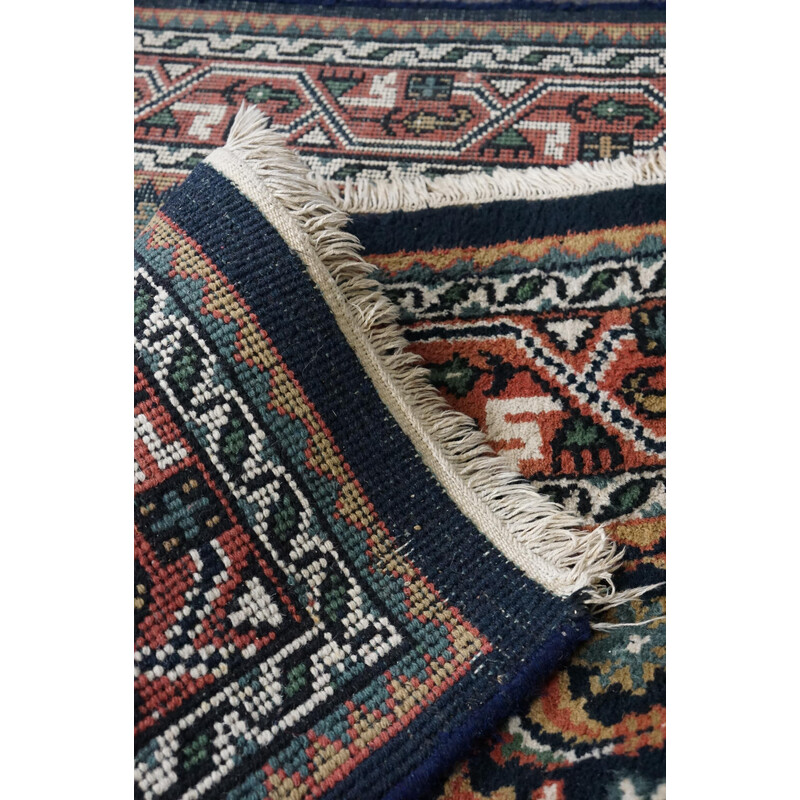 Vintage worn hand-knotted Oriental rug