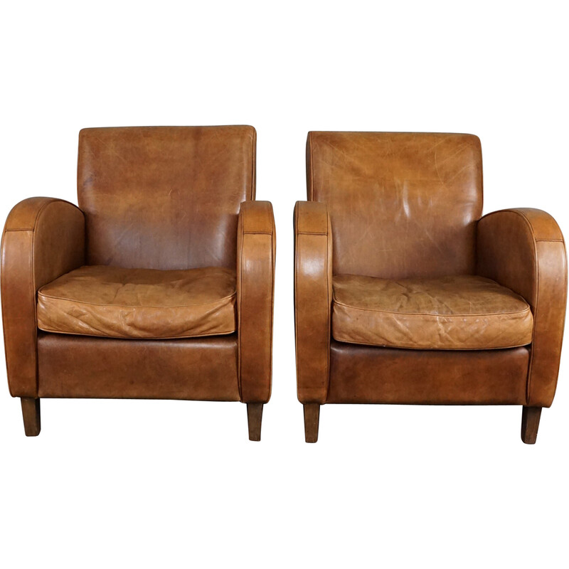 Pair of vintage cowhide leather armchairs