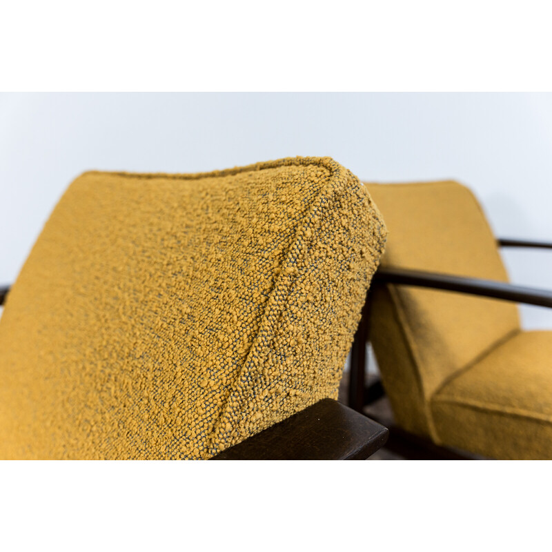 Pair of mid-century yellow bouclé armchairs, Poland 1960s