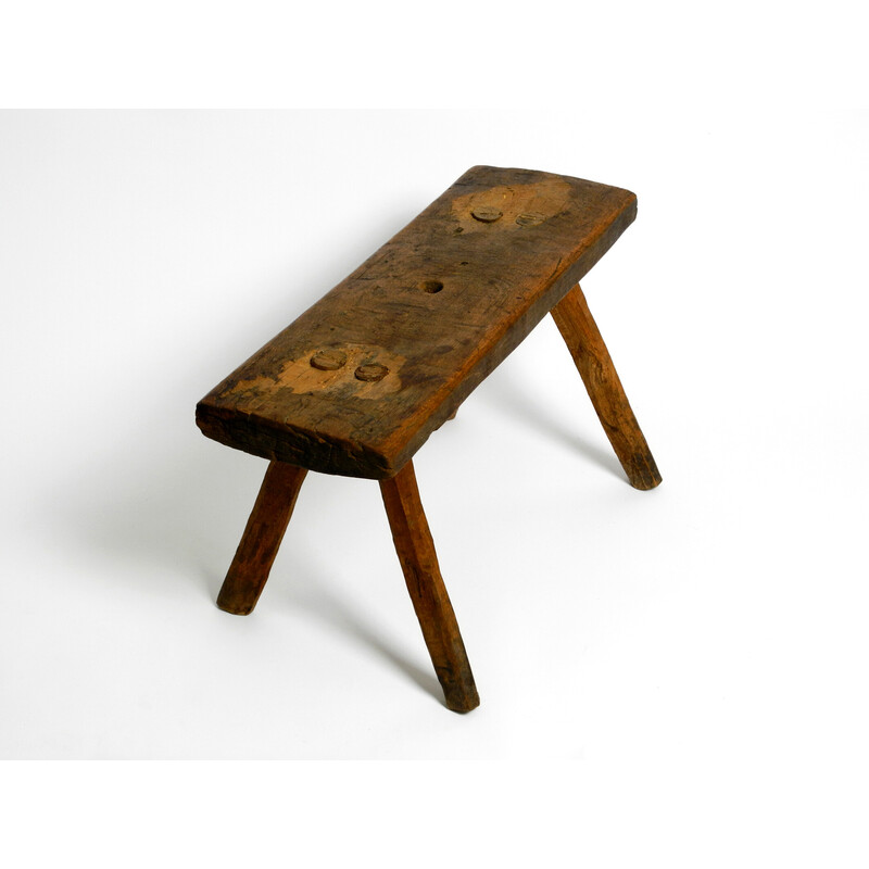 Tabouret vintage oblong à quatre pieds en bois massif