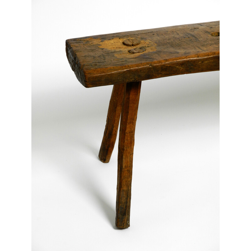 Tabouret vintage oblong à quatre pieds en bois massif