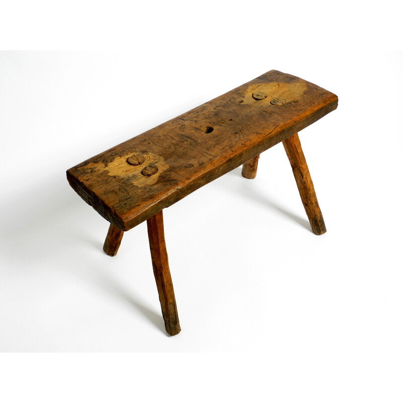 Tabouret vintage oblong à quatre pieds en bois massif