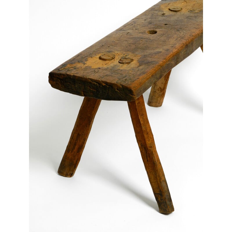 Vintage oblong four-legged solid wood stool