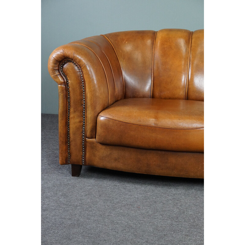 Vintage sheep leather sofa finished with decorative nails