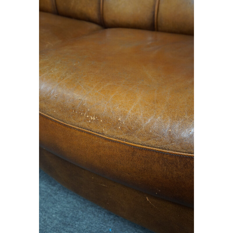 Vintage sheep leather sofa finished with decorative nails