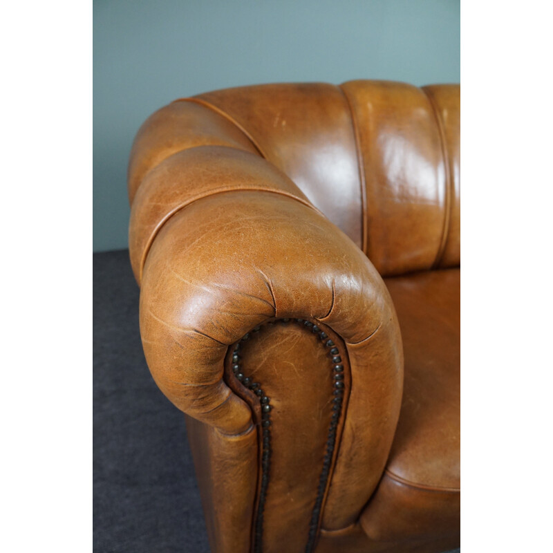 Vintage sheep leather sofa finished with decorative nails