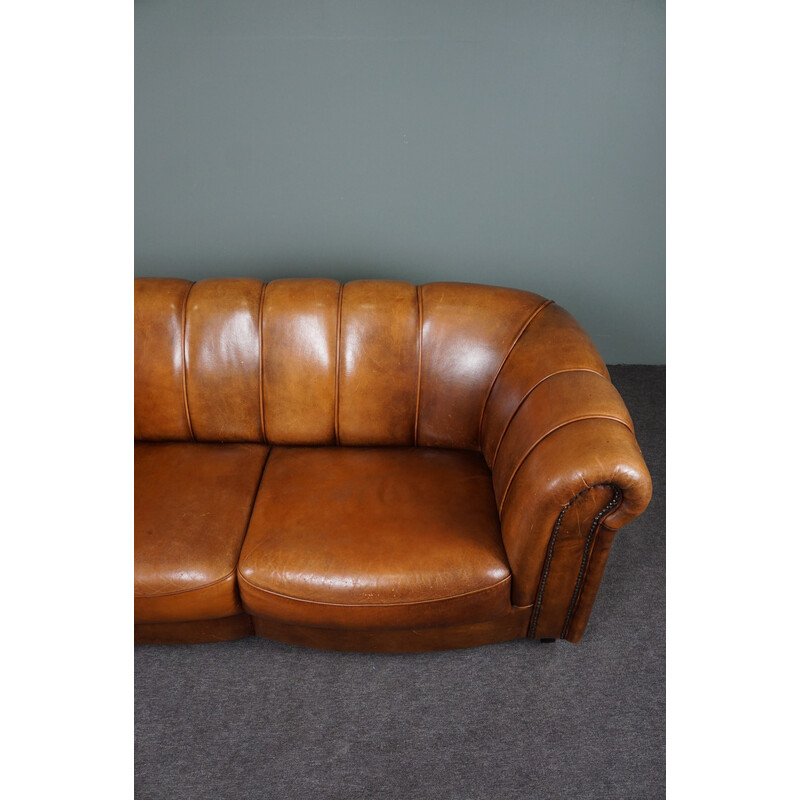 Vintage sheep leather sofa finished with decorative nails