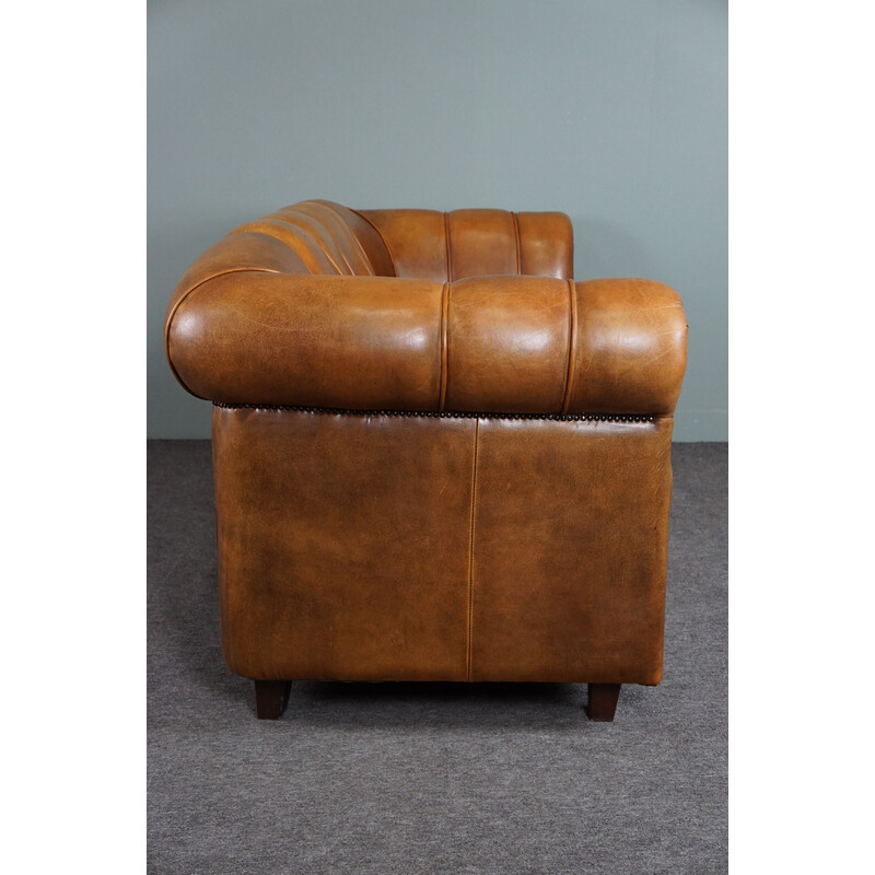 Vintage sheep leather sofa finished with decorative nails