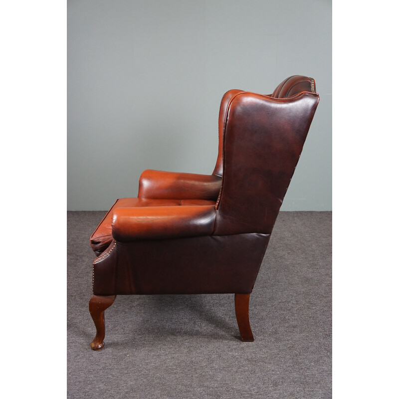 Cadeira de asas vintage "Chesterfield" feita de couro de vaca