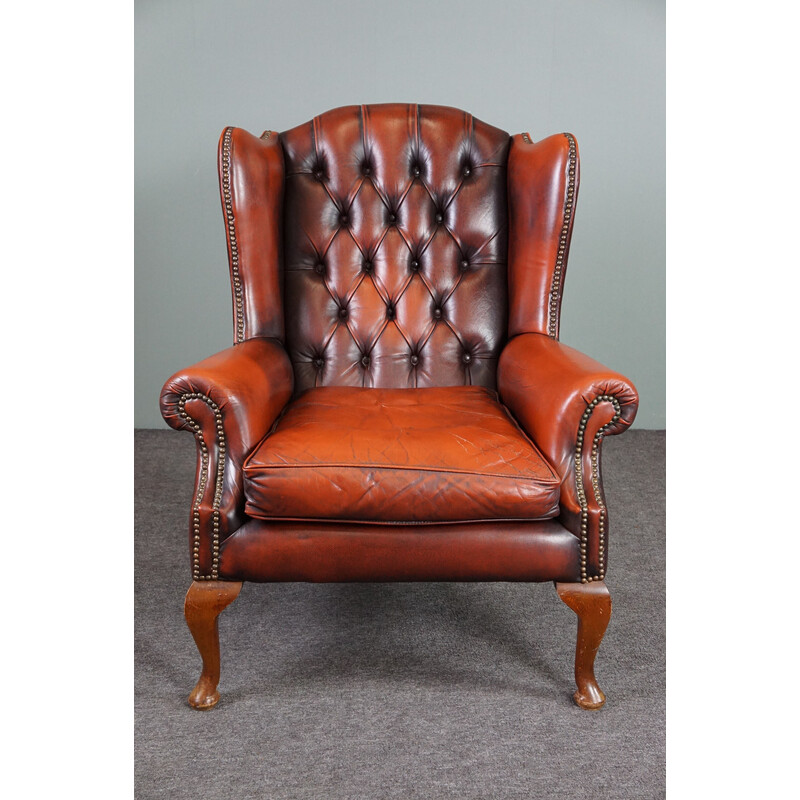 Vintage wing chair "Chesterfield" made of cowhide leather