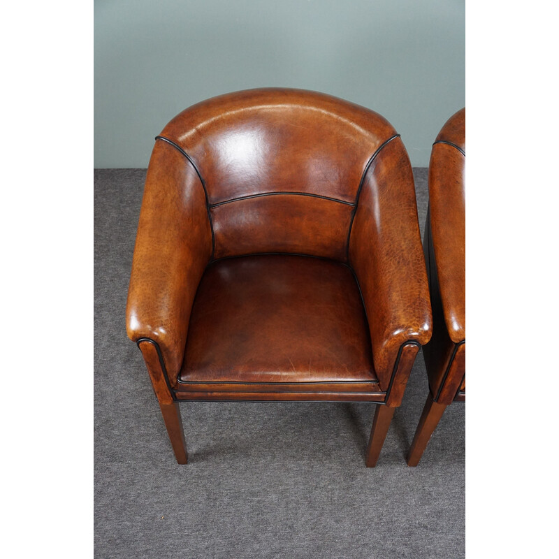 Pair of vintage sheep leather side armchairs