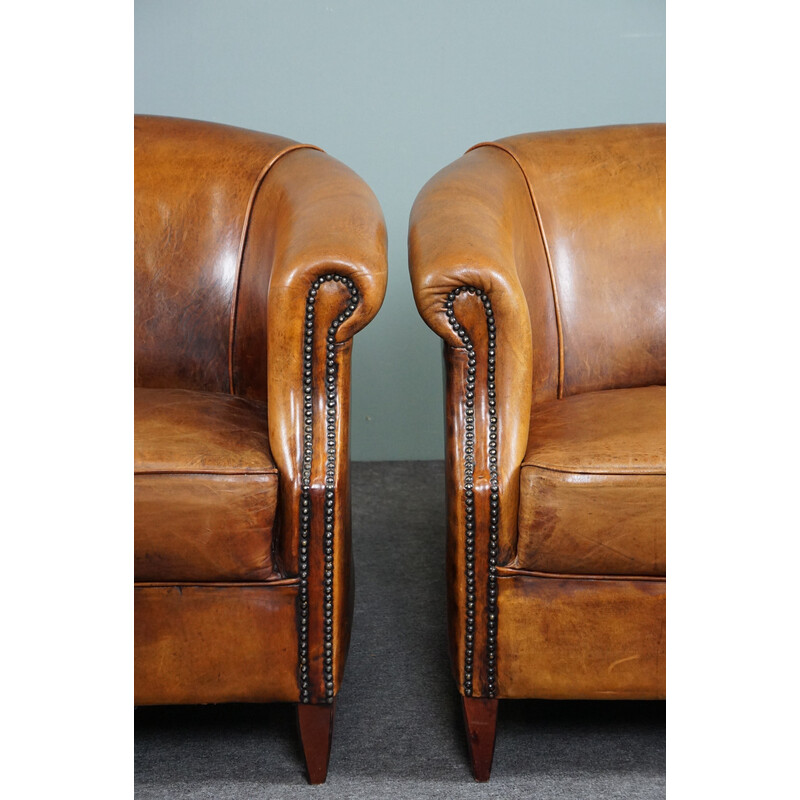 Pair of vintage sheep leather club armchairs