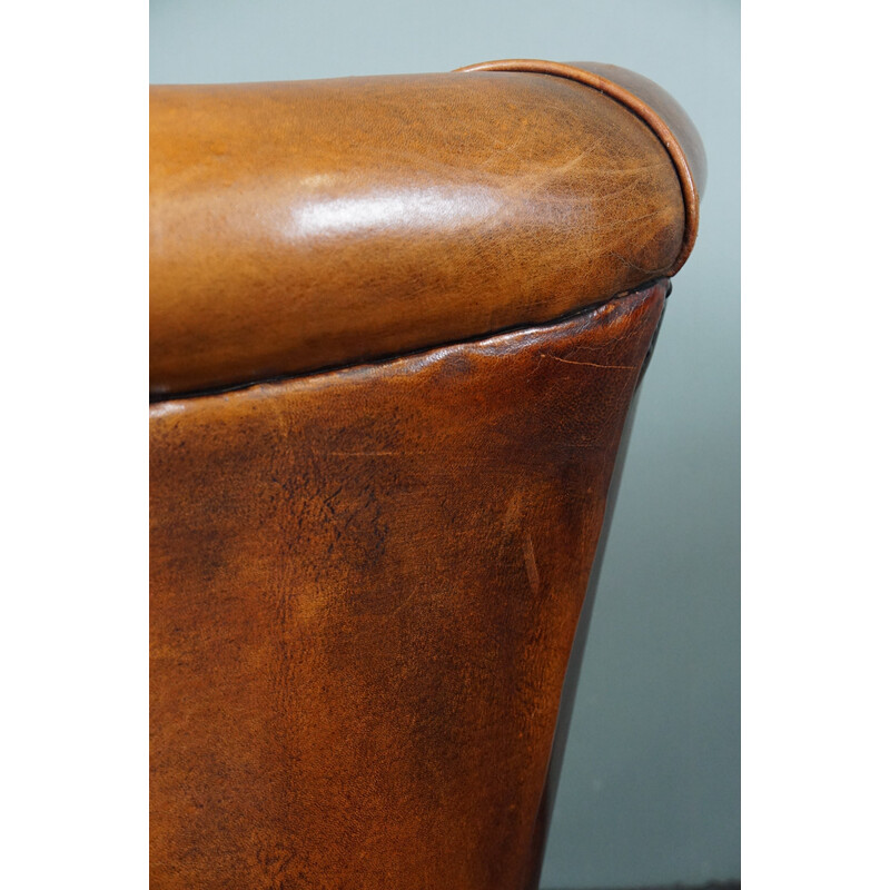 Pair of vintage sheep leather club armchairs