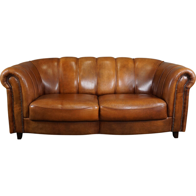 Vintage sheep leather sofa finished with decorative nails