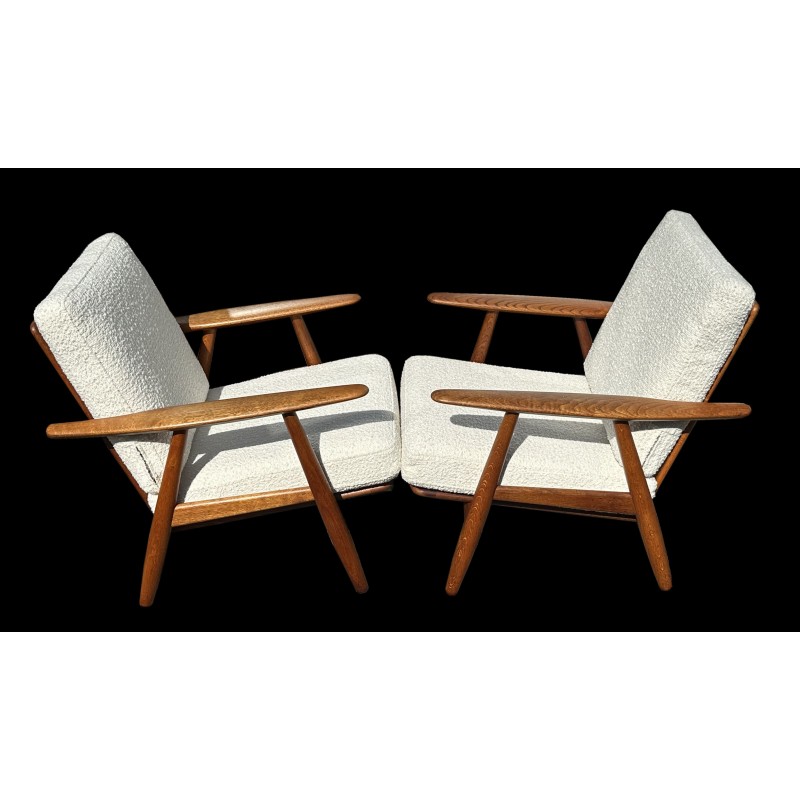 Pair of vintage Ge240 'Cigar' armchairs in oakwood and white boucle fabric by Hans J Wegner for Getama, 1950s