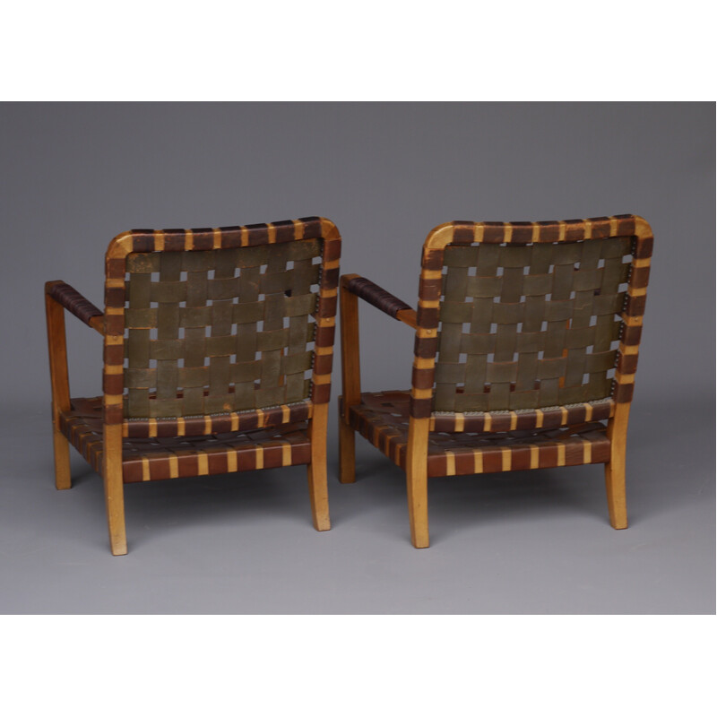 Pair of mid-century French armchairs in walnut and leather, 1950s