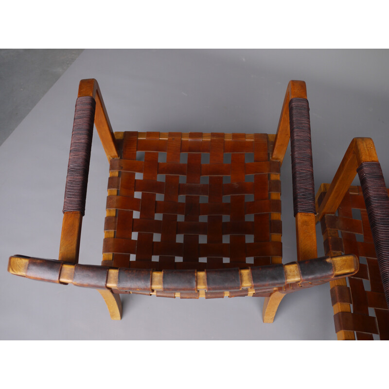 Pair of mid-century French armchairs in walnut and leather, 1950s