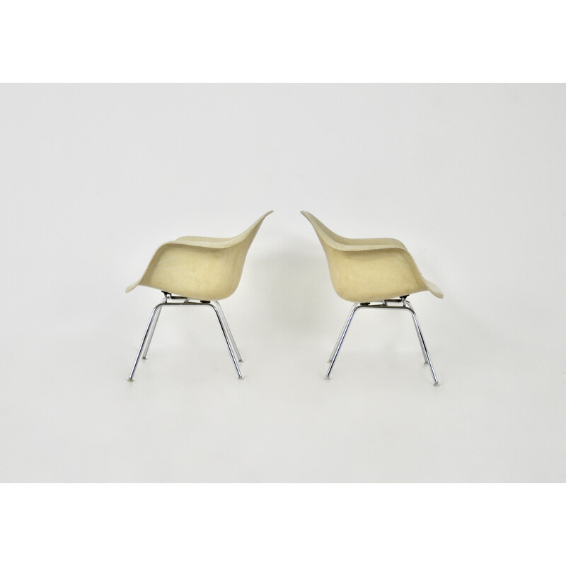 Pair of vintage fiberglass and chrome metal armchairs by Charles and Ray Eames for Herman Miller, 1970