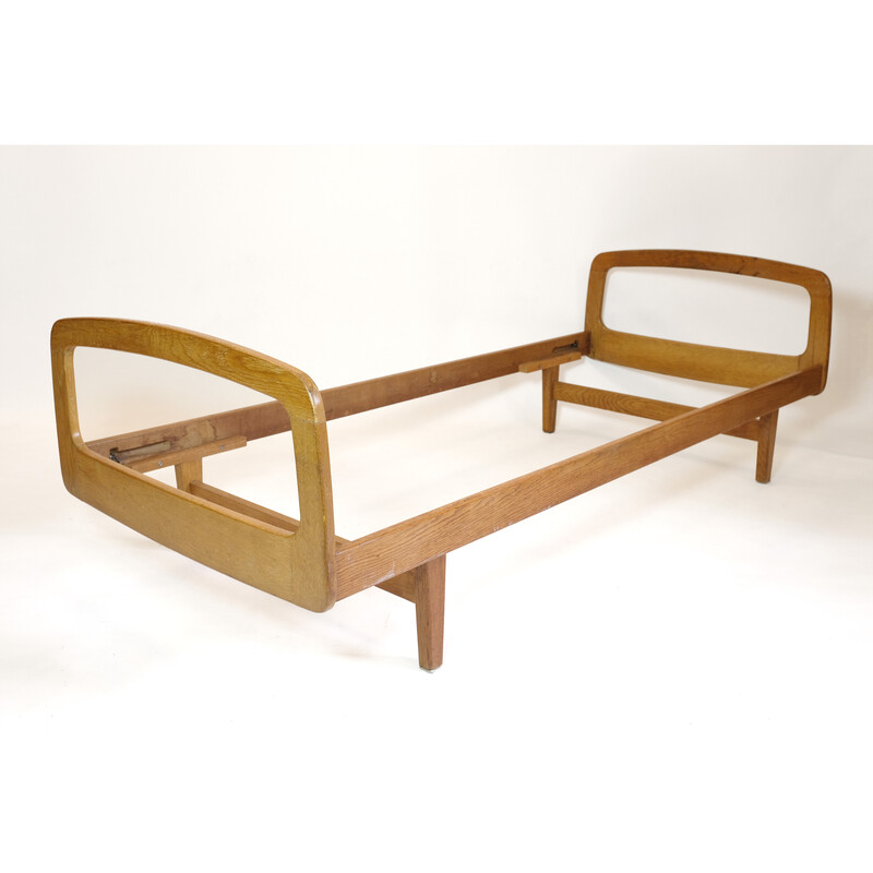 Vintage bed in solid oakwood by Jacques Hauville for Bema, 1950