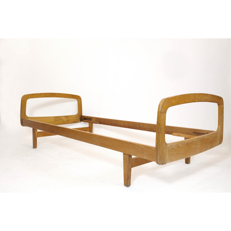 Vintage bed in solid oakwood by Jacques Hauville for Bema, 1950