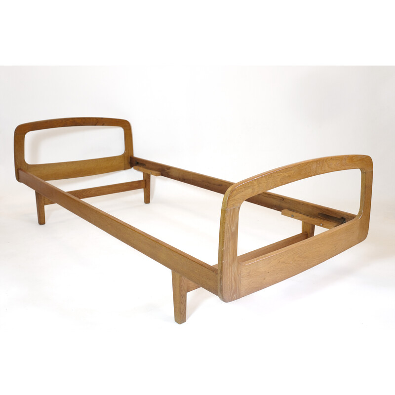 Vintage bed in solid oakwood by Jacques Hauville for Bema, 1950