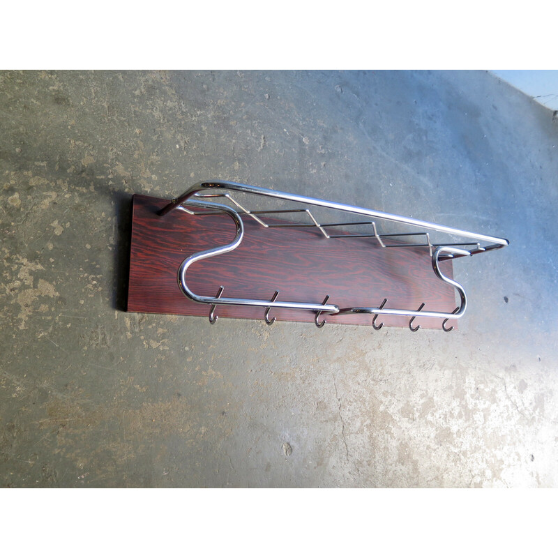 Vintage chrome plated metal coat hook in a wood veneer stand