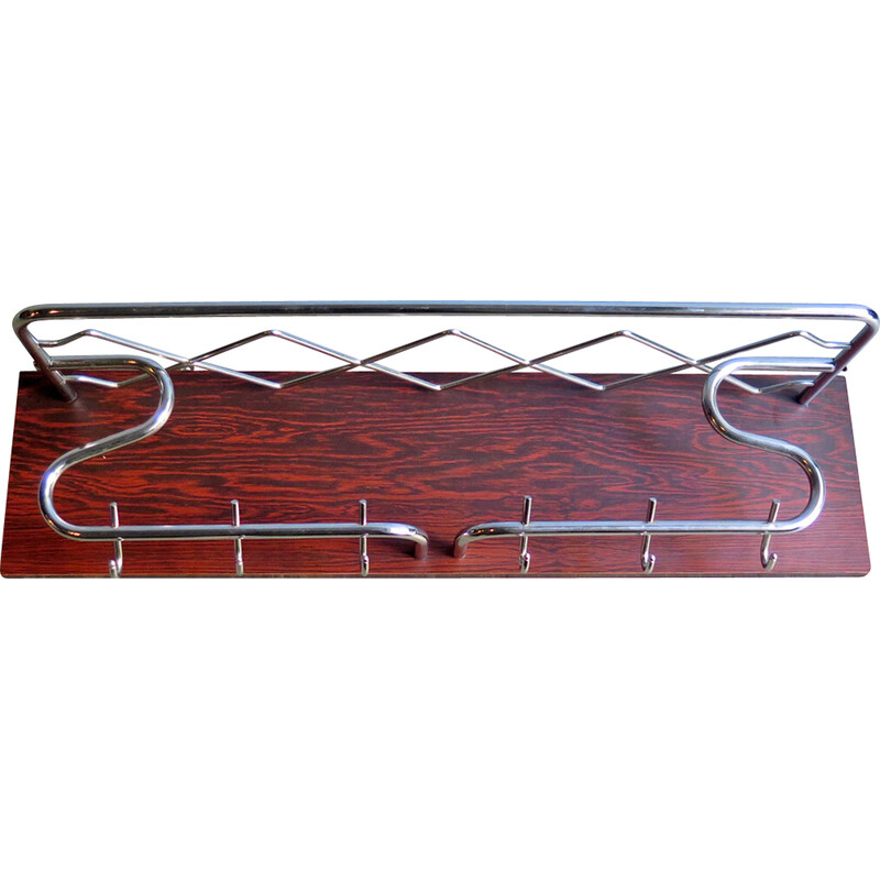 Vintage chrome plated metal coat hook in a wood veneer stand